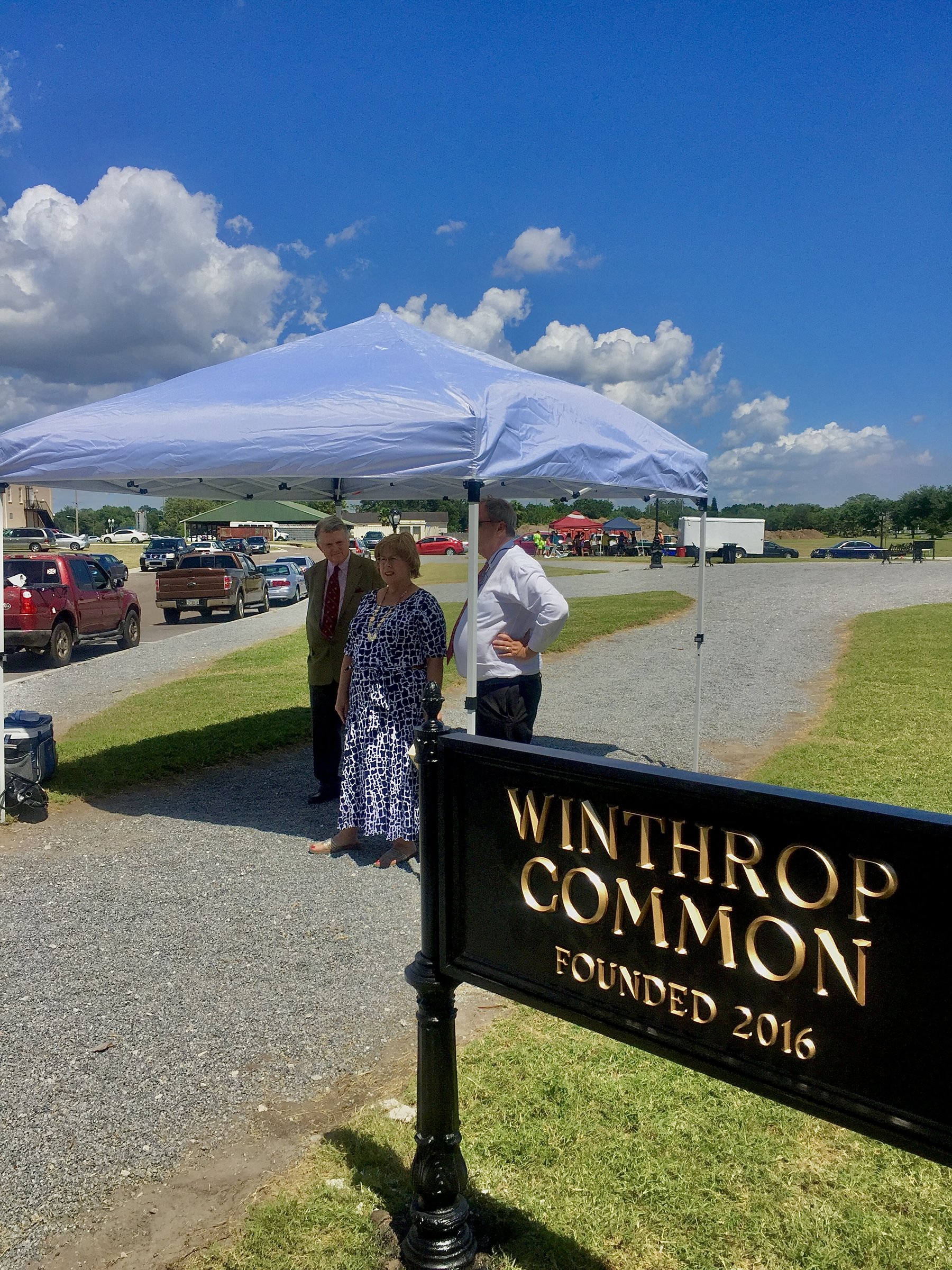 Winthrop Common iron sign with community gathering